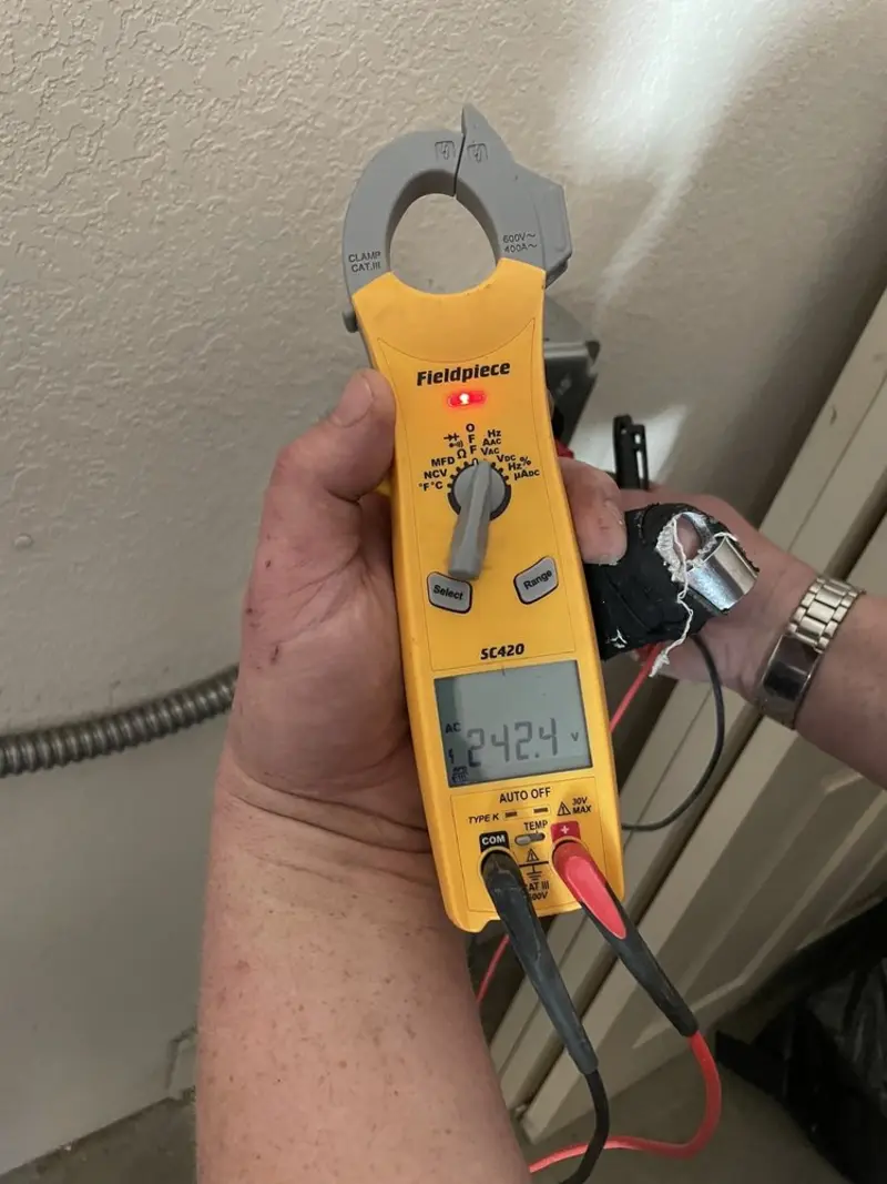 Voltage testing with clamp meter during Electrical Installation Services in Livonia